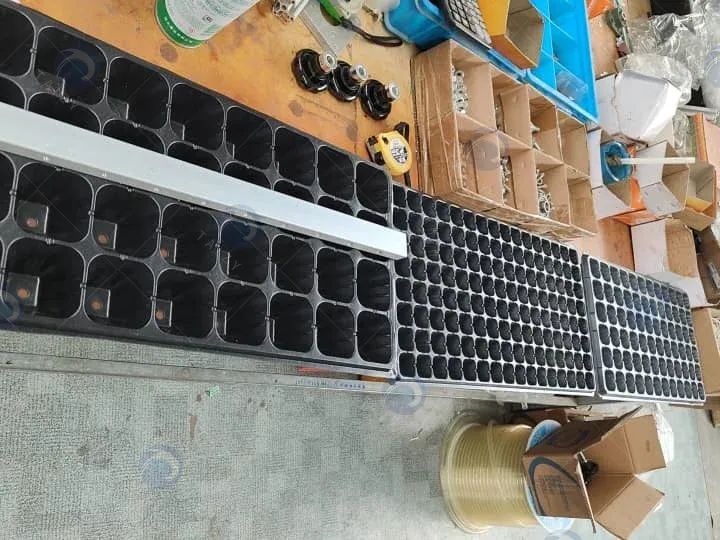 Testing machine with trays