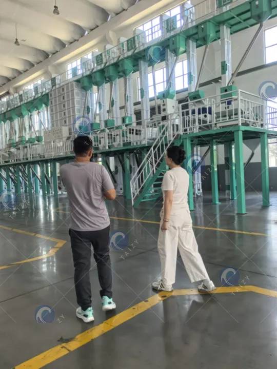 visita a la fábrica de planta de molienda de arroz